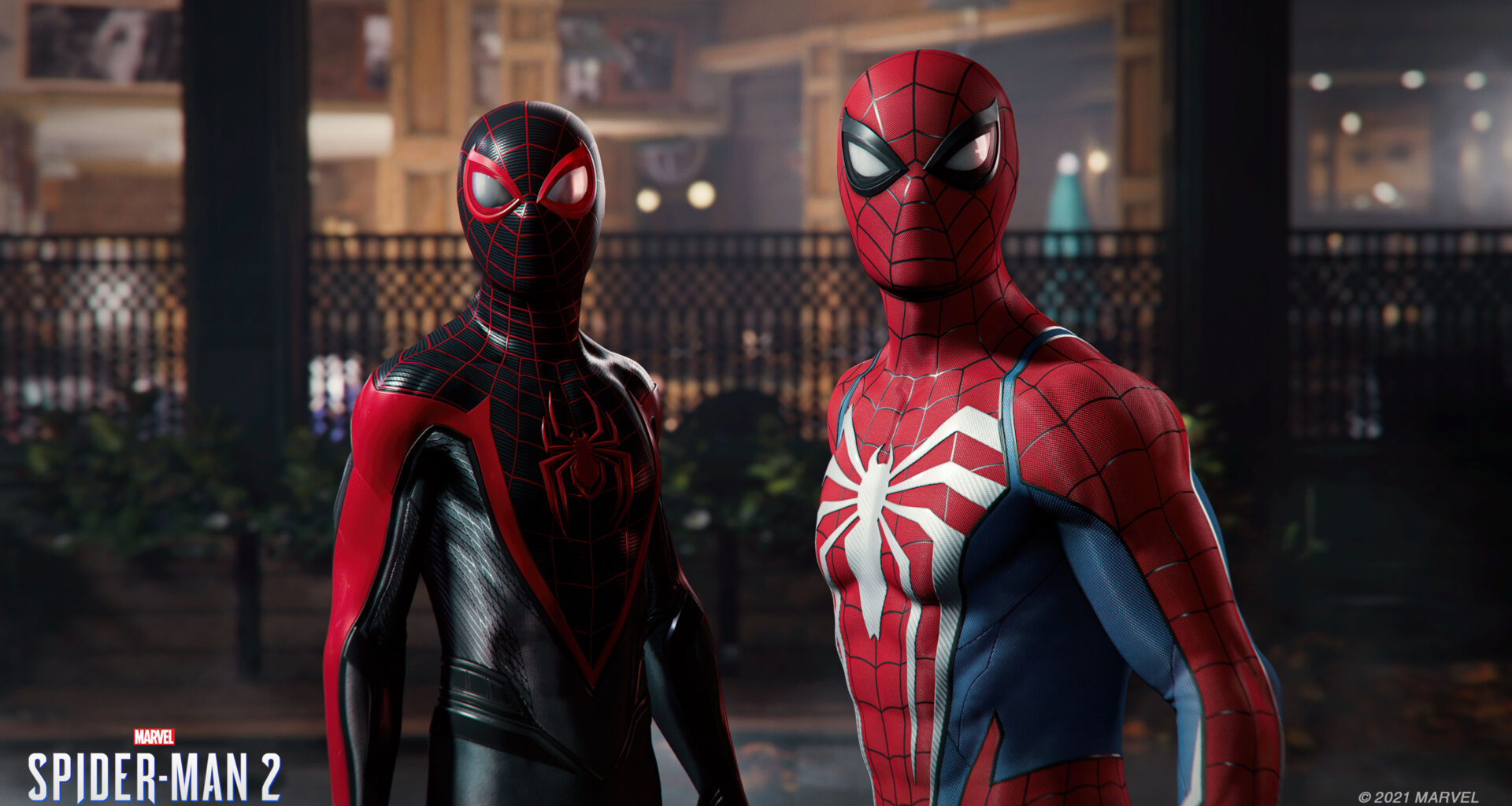 Screenshot aus dem Spiel Marvel's Spider-Man 2, zu sehen sind Miles Morales und Peter Parker in ihren Spider-Man-Kostümen.